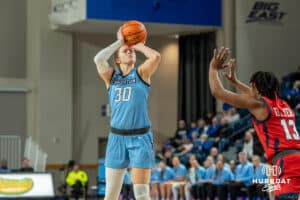 Creighton Bluejays Morgan Maly shoots a three pointer during a college basketball game against St. Johns on February 19th, 2025 in Omaha Nebraska. Photo by Brandon Tiedemann.