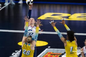 Omaha Supernovas Emily Londot (27) hits the ball over the net against San Diego Mojo Kayla Lund (28) and Rainelle Jones (1) in the second set during a professional volleyball match Sunday, February 16, 2025 in Omaha, Nebraska. Photo by John S. Peterson.