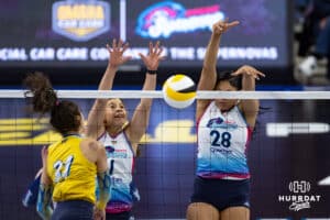 Omaha Supernovas Kayla Caffey (28) with Natalia Valentin-Anderson (1) blocks a spike against San Diego Mojo Maya Tabron (31) in the second set during a professional volleyball match Sunday, February 16, 2025 in Omaha, Nebraska. Photo by John S. Peterson.