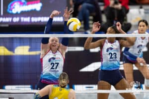 Omaha Supernovas Emily Londot (27) blocks a shot from San Diego Mojo Kayla Lund (28) with Kaitlyn Hord (23) during a professional volleyball match Sunday, February 16, 2025 in Omaha, Nebraska. Photo by John S. Peterson.