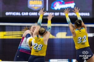 Omaha Supernovas Emily Londot (27) spikes the ball past San Diego Mojo Kayla Lund (28) and Lauren Page (32) in the second set during a professional volleyball match Sunday, February 16, 2025 in Omaha, Nebraska. Photo by John S. Peterson.