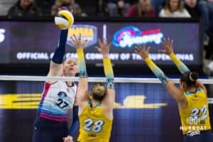 maha Supernovas Emily Londot (27) spikes the ball agianst San Diego Mojo Kayla Lund (28) and sm32 during a professional volleyball match Sunday, February 16, 2025 in Omaha, Nebraska. Photo by John S. Peterson.