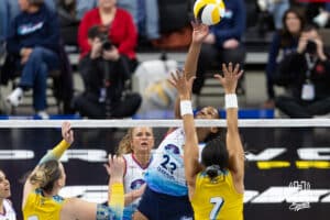 Omaha Supernovas Kaitlyn Hord (23) taps the ball over San Diego Mojo Ronika Stone (7) in the second set during a professional volleyball match Sunday, February 16, 2025 in Omaha, Nebraska. Photo by John S. Peterson.
