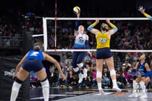 Omaha Supernovas Emily Londot (27) tipes the ball over the net against San Diego Mojo Kayla Lund (28) in the first set during a professional volleyball match Sunday, February 16, 2025 in Omaha, Nebraska. Photo by John S. Peterson.