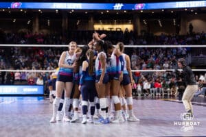 Omaha Supernovas huddle up before the first serve against San Diego Mojo during a professional volleyball match Sunday, February 16, 2025 in Omaha, Nebraska. Photo by John S. Peterson.