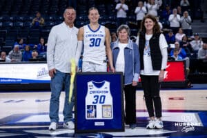 Creighton Bluejay guard Morgan Maly (30) poses with her family on Senior Day after the win against the Georgetown Hoyas during a college basketball game Saturday, February 15, 2025 in Omaha, Nebraska. Photo by John S. Peterson.