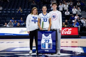Creighton Bluejay guard Brooke Littrell (33) poses with her family on Senior Day after the win over the Georgetown Hoyas during a college basketball game Saturday, February 15, 2025 in Omaha, Nebraska. Photo by John S. Peterson.