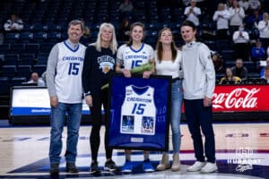 Creighton Bluejay senior Lauren Jensen (15) poses with her family on Senior Day after the win against the Georgetown Hoyas during a college basketball game Saturday, February 15, 2025 in Omaha, Nebraska. Photo by John S. Peterson.