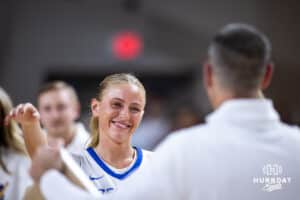 Creighton Bluejay senior Mallory Brake (14) gives head coach Jim Flanery a hug on Senior Day after the game against the Georgetown Hoyas during a college basketball game Saturday, February 15, 2025 in Omaha, Nebraska. Photo by John S. Peterson.