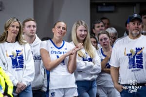 Creighton Bluejay forward Mallory Brake (14) watching a Senior Day video with her family after the game against the Georgetown Hoyas during a college basketball game Saturday, February 15, 2025 in Omaha, Nebraska. Photo by John S. Peterson.