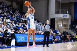 Creighton Bluejay forward Mallory Brake (14) makes a three-point shot against the Georgetown Hoyas in the fourth quarter during a college basketball game Saturday, February 15, 2025 in Omaha, Nebraska. Photo by John S. Peterson.