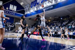 Creighton Bluejay guard Lauren Jensen (15) makes a layup against the Georgetown Hoyas in the fourth quarter during a college basketball game Saturday, February 15, 2025 in Omaha, Nebraska. Photo by John S. Peterson.
