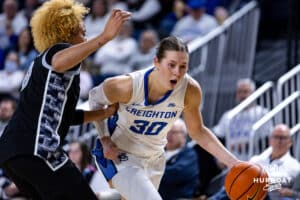 Creighton Bluejay guard Morgan Maly (30) dribbles the ball against Georgetown Hoya guard Khadee Hession (8) in the fourth quarter during a college basketball game Saturday, February 15, 2025 in Omaha, Nebraska. Photo by John S. Peterson.