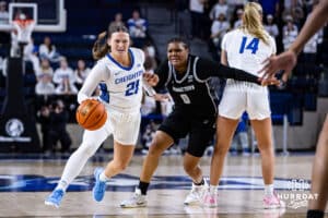 Creighton Bluejay guard Molly Mogensen (21) dribbles the ball against Georgetown Hoya guard Jaeda Wilson (0) in the third quarter during a college basketball game Saturday, February 15, 2025 in Omaha, Nebraska. Photo by John S. Peterson.