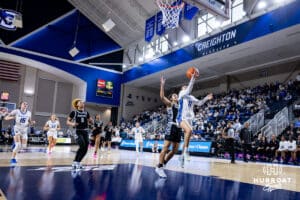 Creighton Bluejay guard Kiani Lockett (11) makes a lay up against Georgetown Hoya guard Kelsey Ransom (1) in the second quarter during a college basketball game Saturday, February 15, 2025 in Omaha, Nebraska. Photo by John S. Peterson.
