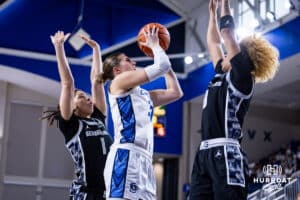 Creighton Bluejay guard Morgan Maly (30) makes a lay up against Georgetown Hoya guard Khadee Hession (8) and Kelsey Ransom in the second quarter during a college basketball game Saturday, February 15, 2025 in Omaha, Nebraska. Photo by John S. Peterson.