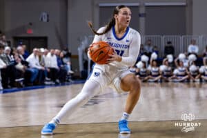 Creighton Bluejay guard Molly Mogensen (21) dribbles the ball against the Georgetown Hoyas in the first quarter during a college basketball game Saturday, February 15, 2025 in Omaha, Nebraska. Photo by John S. Peterson.
