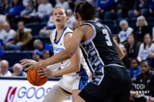Creighton Bluejay guard Morgan Maly (30) lines up a jump shot against Georgetown Hoya guard Victoria Rivera (3) in the first quarter during a college basketball game Saturday, February 15, 2025 in Omaha, Nebraska. Photo by John S. Peterson.