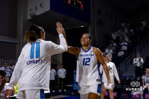 Creighton Bluejay guard Jayme Horan (12) high fives guard Kiani Lockett (11) when introduced before taking on the Georgetown Hoyas during a college basketball game Saturday, February 15, 2025 in Omaha, Nebraska. Photo by John S. Peterson.