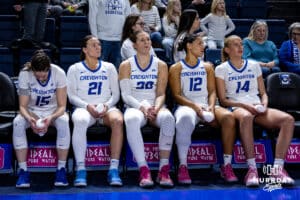 Creighton Bluejays Lauren Jensen (15), guard Molly Mogensen (21), guard Morgan Maly (30), guard Jayme Horan (12), and forward Mallory Brake (14) waiting for introductions before taking on the Georgetown Hoyas during a college basketball game Saturday, February 15, 2025 in Omaha, Nebraska. Photo by John S. Peterson.