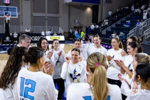 Creighton Bluejay guard Molly Mogensen (21) dances in the huddle before taking on Georgetown Hoyas during a college basketball game Saturday, February 15, 2025 in Omaha, Nebraska. Photo by John S. Peterson.