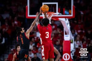 Nebraska Cornhusker guard Brice Williams (3) makes a three-point shot against Maryland Terrapin guard Rodney Rice (1) in the second half during a college basketball game Thursday, February 13, 2025 in Lincoln, Nebraska. Photo by John S. Peterson.