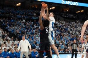 Creighton Bluejays Ryan Kalkbrenner gets his shot contested during a college basketball game against UCONN on February 11th, 2025 in Omaha Nebraska. Photo by Brandon Tiedemann.