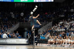 Creighton Bluejays halftime performer Red Panda flips bowls during a college basketball game against UCONN on February 11th, 2025 in Omaha Nebraska. Photo by Brandon Tiedemann.
