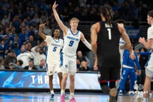 Creighton Bluejays Ty Davis celebrates a Jamiya Neal three during a college basketball game against UCONN on February 11th, 2025 in Omaha Nebraska. Photo by Brandon Tiedemann.