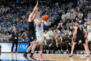 Creighton Bluejays Ty Davis drives to the hoop during a college basketball game against UCONN on February 11th, 2025 in Omaha Nebraska. Photo by Brandon Tiedemann.