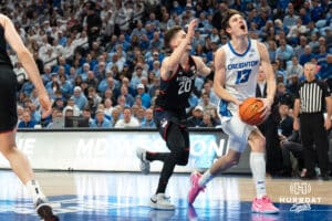 Creighton Bluejays Mason Miller gets fouled during a college basketball game against UCONN on February 11th, 2025 in Omaha Nebraska. Photo by Brandon Tiedemann.
