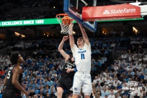 Creighton Bluejays Ryan Kalkbrenner dunks during a college basketball game against UCONN on February 11th, 2025 in Omaha Nebraska. Photo by Brandon Tiedemann.