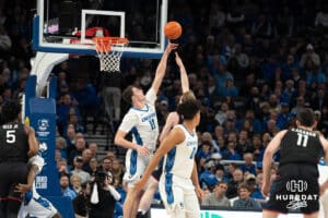 Creighton Bluejays Ryan Kalkbrenner blocks a shot during a college basketball game against UCONN on February 11th, 2025 in Omaha Nebraska. Photo by Brandon Tiedemann.