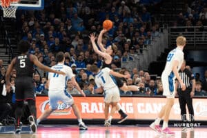 Creighton Bluejays Steven Ashworth defends during a college basketball game against UCONN on February 11th, 2025 in Omaha Nebraska. Photo by Brandon Tiedemann.