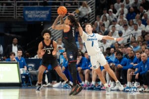 Creighton Bluejays Steven Ashworth contests a shot during a college basketball game against UCONN on February 11th, 2025 in Omaha Nebraska. Photo by Brandon Tiedemann.