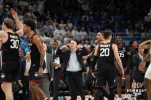 UConn Huskies head coach Dan Hurley celebrates after a Creighton timeout during a college basketball game against Creighton on February 11th, 2025 in Omaha Nebraska. Photo by Brandon Tiedemann.