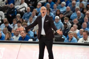 UConn Huskies head coach Dan Hurley upset with a foul call during a college basketball game against Creighton on February 11th, 2025 in Omaha Nebraska. Photo by Brandon Tiedemann.