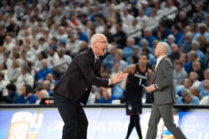 UConn Huskies head coach Dan Hurley taunts the crowd during a college basketball game against Creighton on February 11th, 2025 in Omaha Nebraska. Photo by Brandon Tiedemann.