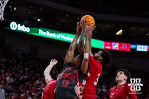 Nebraska Cornhusker guard Brice Williams (3) reaches for the rebound against Ohio State Buckeye forward Sean Stewart (13) in the second half during a college men’s basketball game on Sunday, February 9, 2025, in Lincoln, Nebraska. Photo by John S. Peterson.