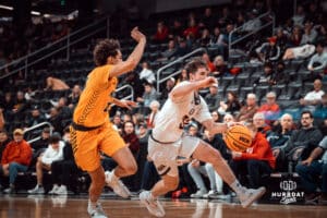 Omaha Maverick Tony Osburn dribbles past a defender against the North Dakota State Bison during a college basketball game on Saturday, February 8, 2025 in Omaha, Nebraska. Photo by Logan Hock.