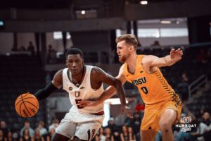 Omaha Maverick Ja'Sean Glover dribbles past a defender against the North Dakota State Bison during a college basketball game on Saturday, February 8, 2025 in Omaha, Nebraska. Photo by Logan Hock.