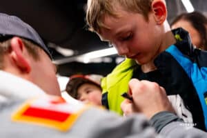 Omaha Maverick signing autograph during a hockey match at Baxter Arena on Saturday, February 2, 2025, in Omaha, Nebraska. Photo by Collin Stilen.