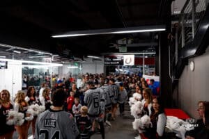 Omaha Mavericks greet fans waiting in the lobby during a hockey match at Baxter Arena on Saturday, February 2, 2025, in Omaha, Nebraska. Photo by Collin Stilen.