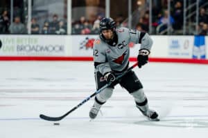 Omaha Maverick Nolan Krenzen looks to move the puck during a hockey match at Baxter Arena on Saturday, February 2, 2025, in Omaha, Nebraska. Photo by Collin Stilen.