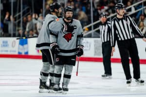Omaha Maverick Brady Risk celebrating his goal with Sam Stange during a hockey match at Baxter Arena on Saturday, February 2, 2025, in Omaha, Nebraska. Photo by Collin Stilen.