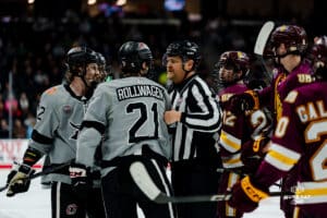 Omaha Maverick Tyler Rollwagen swaps verbage with some players on Minnesota Duluth during a hockey match at Baxter Arena on Saturday, February 2, 2025, in Omaha, Nebraska. Photo by Collin Stilen.