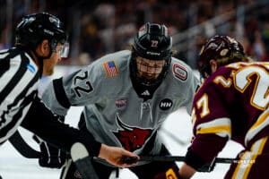 Omaha Maverick Jimmy Glynn taking the faceoff during a hockey match at Baxter Arena on Saturday, February 2, 2025, in Omaha, Nebraska. Photo by Collin Stilen.