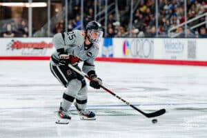 Omaha Maverick Cam Mitchell looks to shoot the puck during a hockey match at Baxter Arena on Saturday, February 2, 2025, in Omaha, Nebraska. Photo by Collin Stilen.
