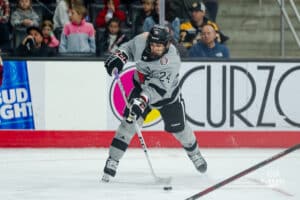 Omaha Maverick Charlie Lurie shoots the puck during a hockey match at Baxter Arena on Saturday, February 2, 2025, in Omaha, Nebraska. Photo by Collin Stilen.