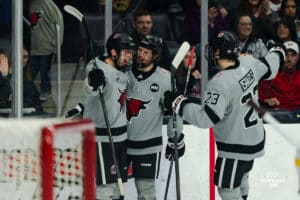 Omaha Mavericks Brady Risk and teammates celebrate the goal by Risk during a hockey match at Baxter Arena on Saturday, February 2, 2025, in Omaha, Nebraska. Photo by Collin Stilen.